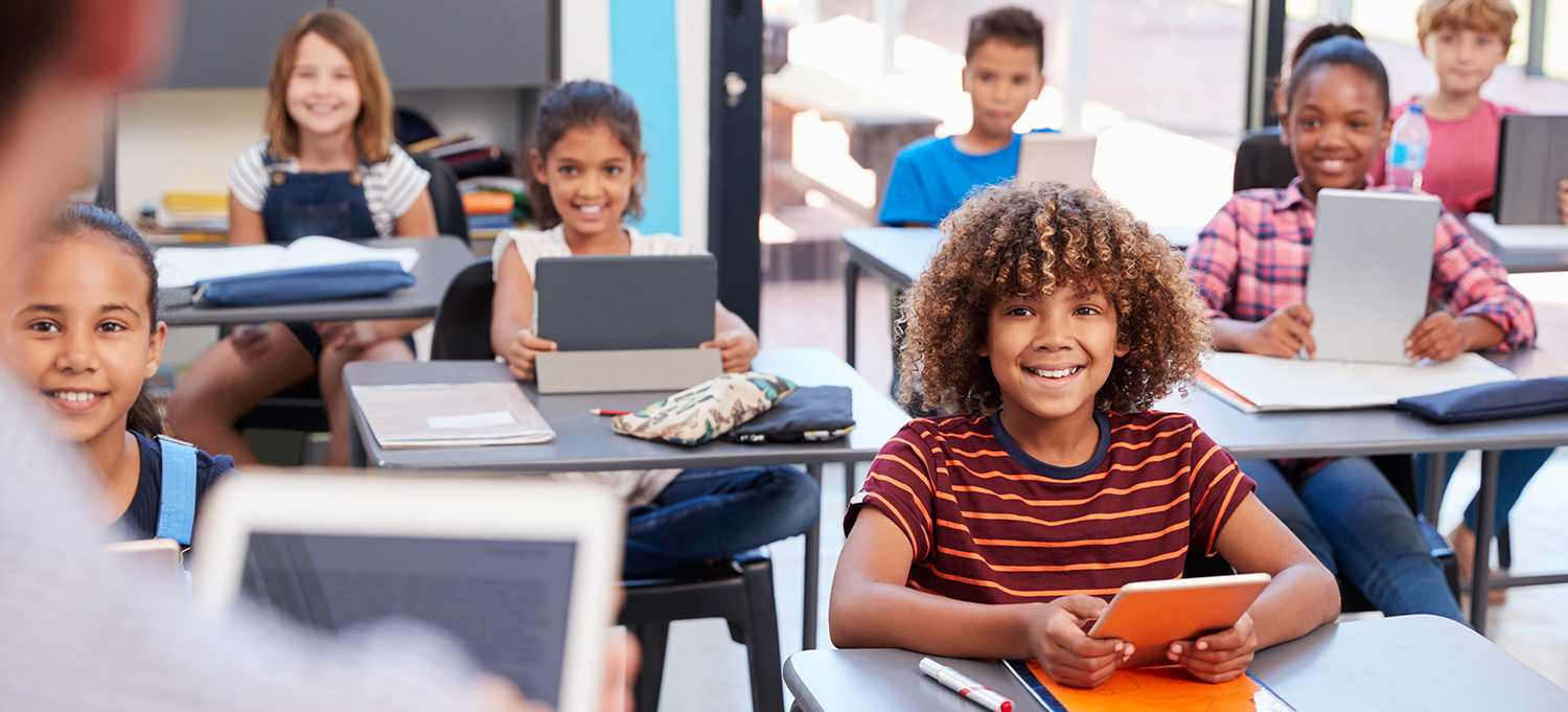 classroom with students using tablets